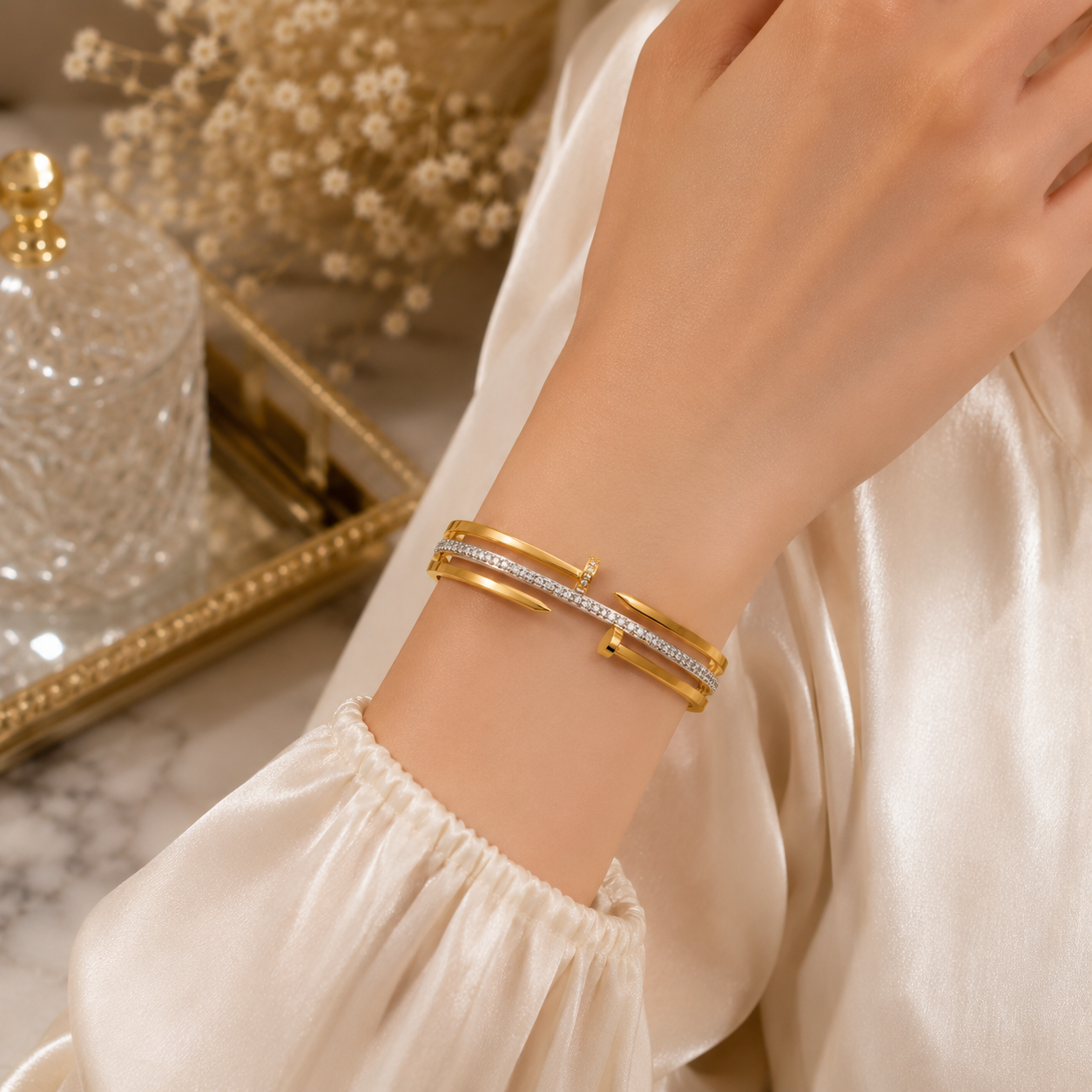 Woman wearing Gold Plated Stainless Steel Nail Crystal Cuff Bracelet | Sultan Jewelers