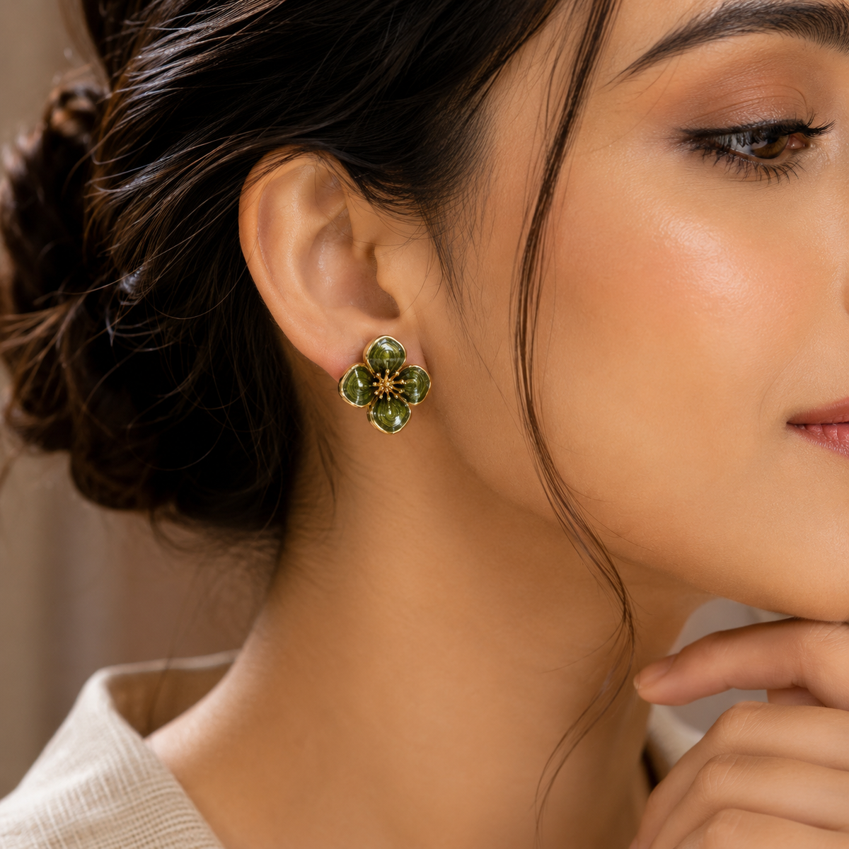 Close-up model wearing Elegant Green Enamel Floral Stud Earrings.