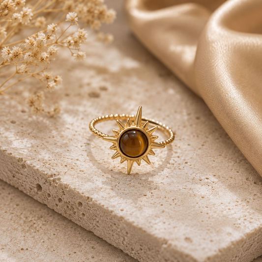 Luxury Celestial Tiger Eye Gold Ring Set displayed on an elegant ivory stone background.