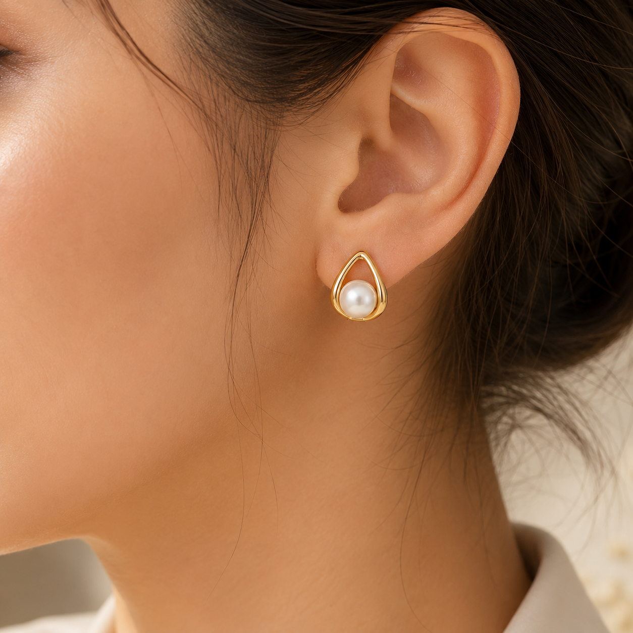 Woman wearing Elegant Pearl Drop Gold Stud Earrings for Women | Sultan Jewelersportrait.
