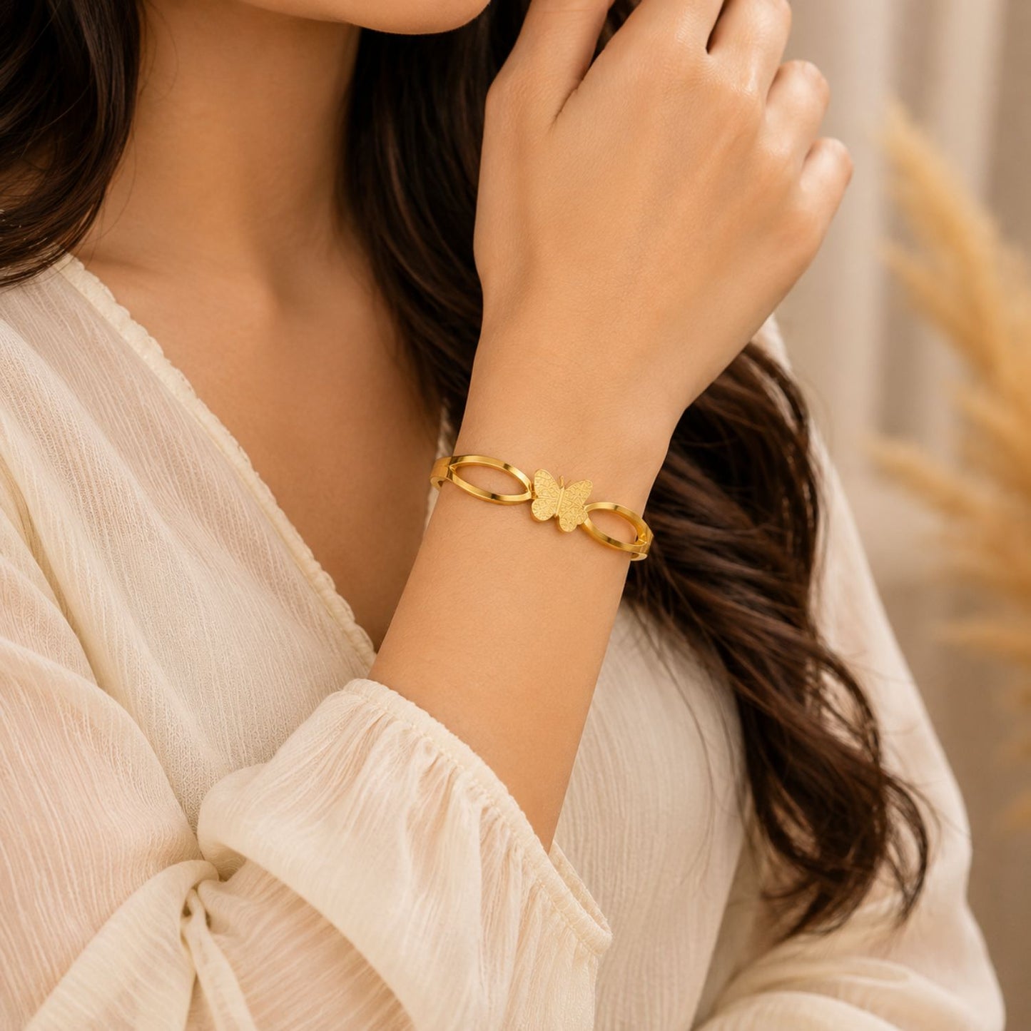 Woman wearing Golden Butterfly Elegance Bangle | Sultan Jewelers